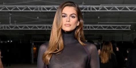 Kaia Gerber flashes major side boob in leather dungarees.